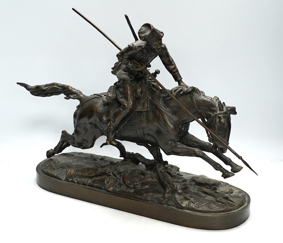 After Eugene Lanceray (Russian, 1848-1886), bronze study of a Cossack charging, signed in cyrillic, 39cm wide. Condition - good